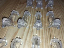 Série de 12 porte-couteaux Danone – Chiens – Bakélite / plastique dur – Ann