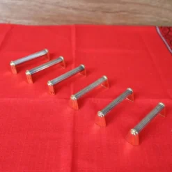 Série de 6 porte couteaux en métal argenté et doré