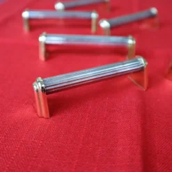Série de 6 porte couteaux en métal argenté et doré