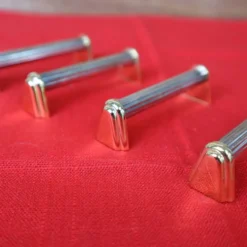 Série de 6 porte couteaux en métal argenté et doré