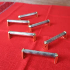 Série de 6 porte couteaux en métal argenté et doré