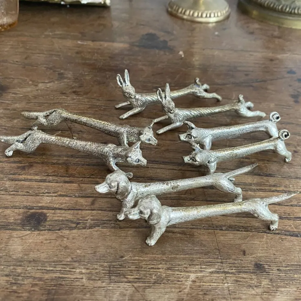 Suite de 8 porte-couteaux anciens en métal argenté Animaux