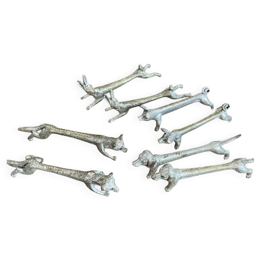 Suite de 8 porte-couteaux anciens en métal argenté Animaux