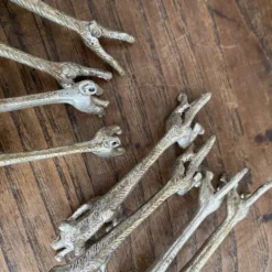 Suite de 8 porte-couteaux anciens en métal argenté Animaux