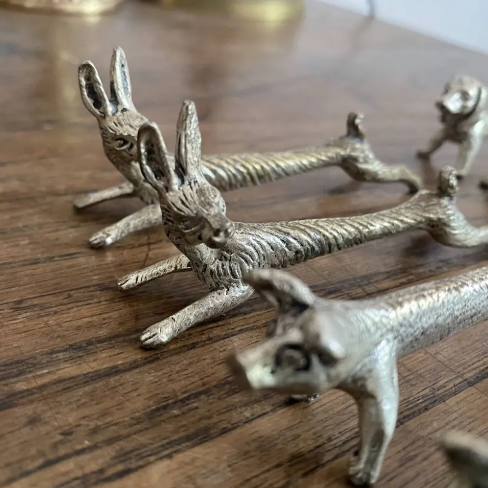 Suite de 8 porte-couteaux anciens en métal argenté Animaux