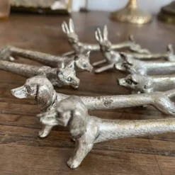 Suite de 8 porte-couteaux anciens en métal argenté Animaux