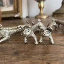 Suite de 8 porte-couteaux anciens en métal argenté Animaux