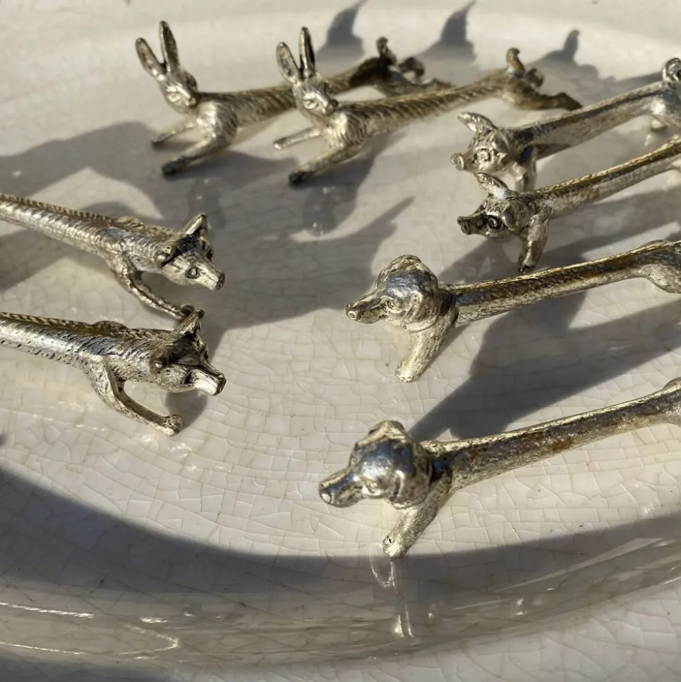 Suite de 8 porte-couteaux anciens en métal argenté Animaux