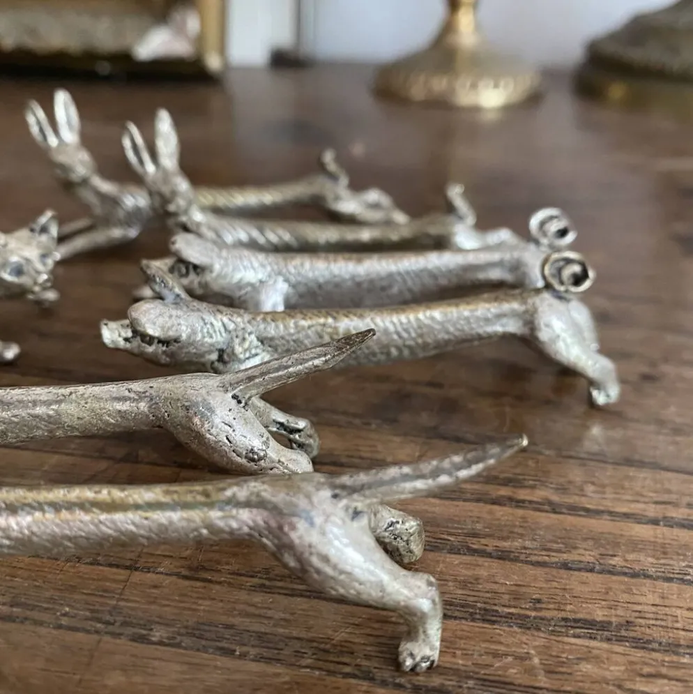 Suite de 8 porte-couteaux anciens en métal argenté Animaux