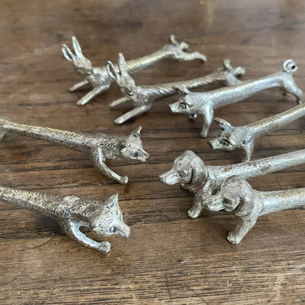 Suite de 8 porte-couteaux anciens en métal argenté Animaux