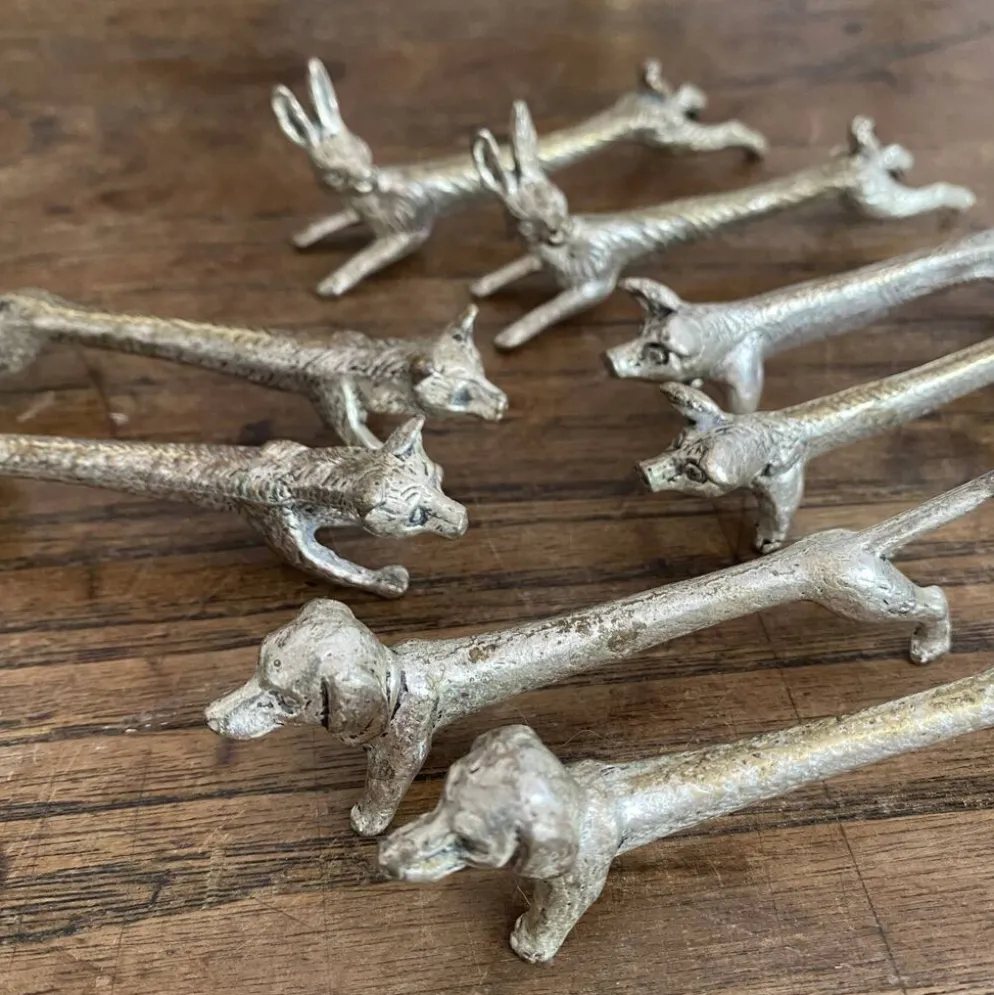 Suite de 8 porte-couteaux anciens en métal argenté Animaux