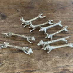 Suite de 8 porte-couteaux anciens en métal argenté Animaux