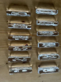 Suite de 12 porte-couteaux en cristal de Daum - 1960