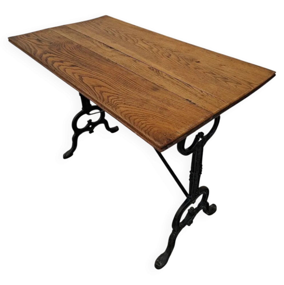 Table de bistrot en chêne massif et piètement en fonte signé