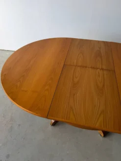 Table à manger extensible ronde à piètement en croix