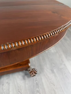 Table ovale de style Empire à pied central, XIXe siècle